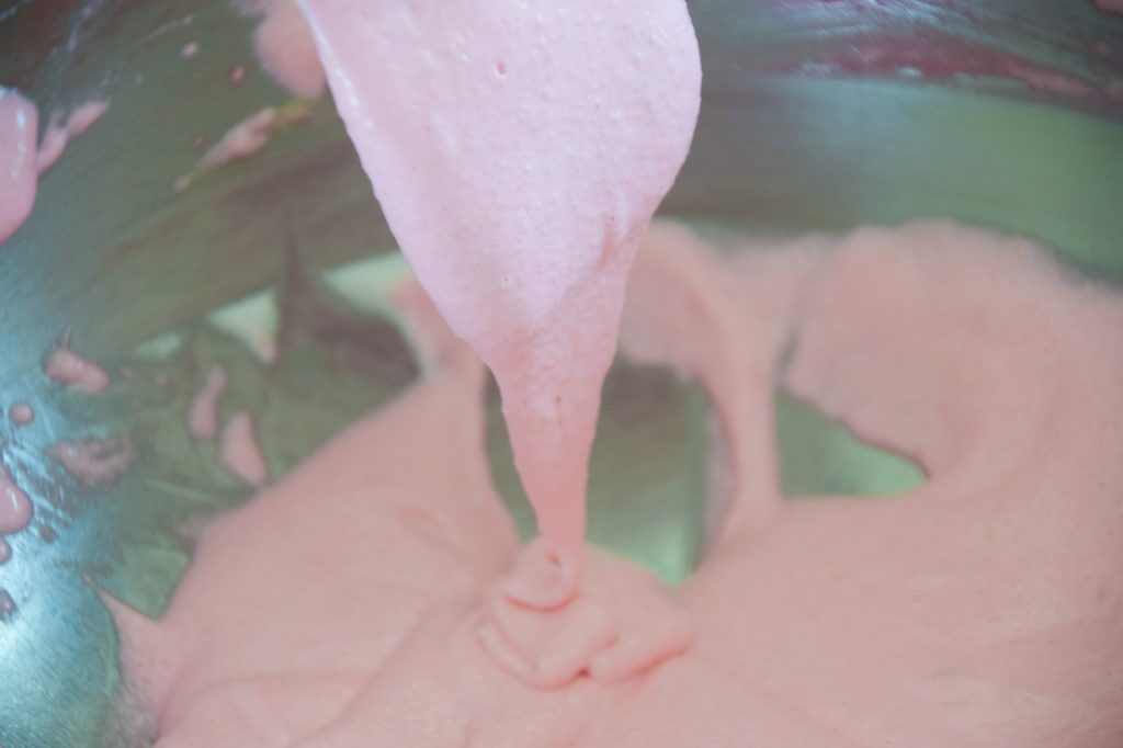 Folding the pink macaron batter