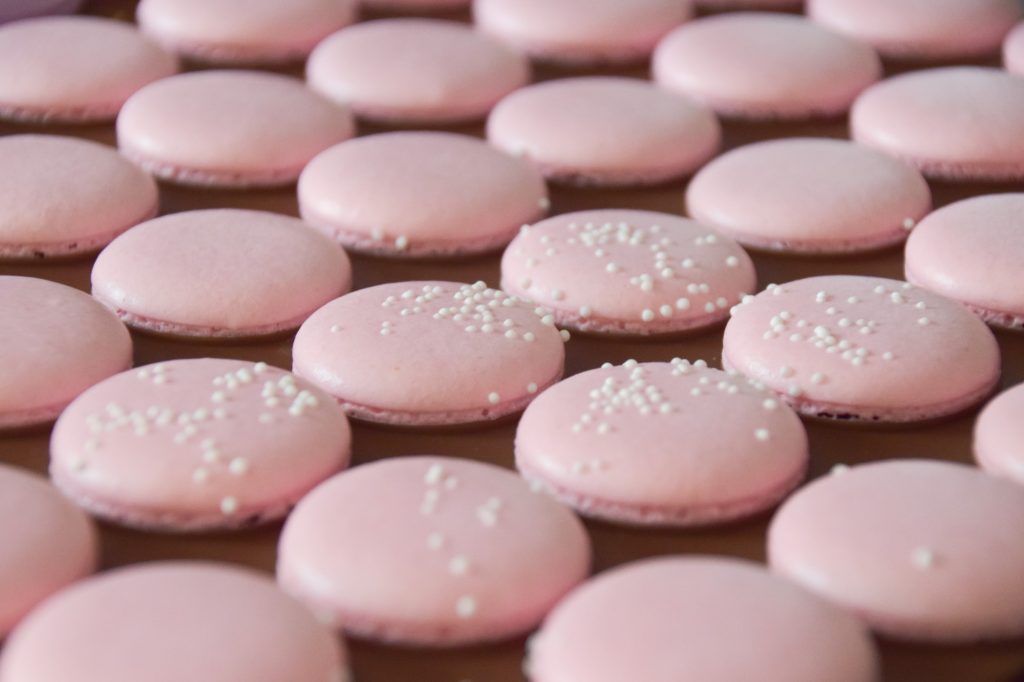 Light pink macarons with white sprinkles