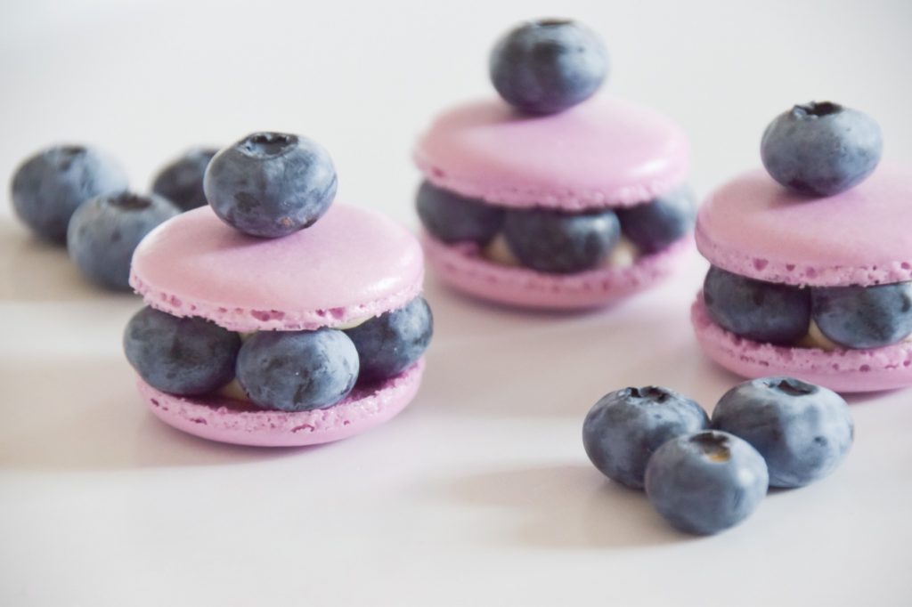 Purple blueberry macarons with fresh blueberries