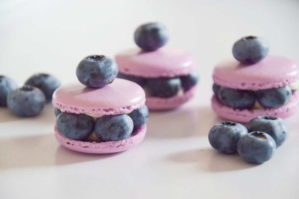 Purple blueberry macarons with fresh blueberries