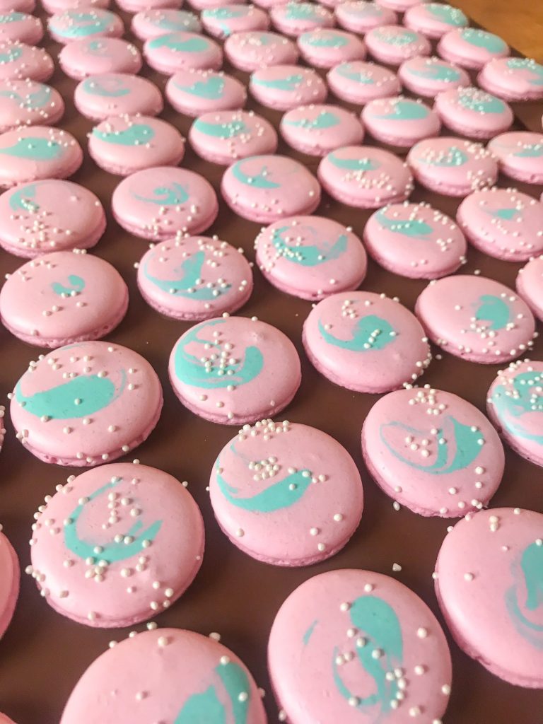 Pink bubble gum macarons shells with nonpareils