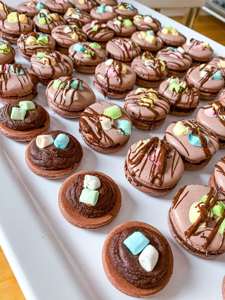 Chocolate macarons with marshmallows chocolate ganache filling chocolate drizzle
