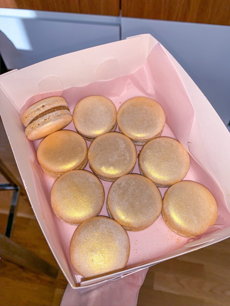 Shiny sparkling macarons with gold edible luster dust