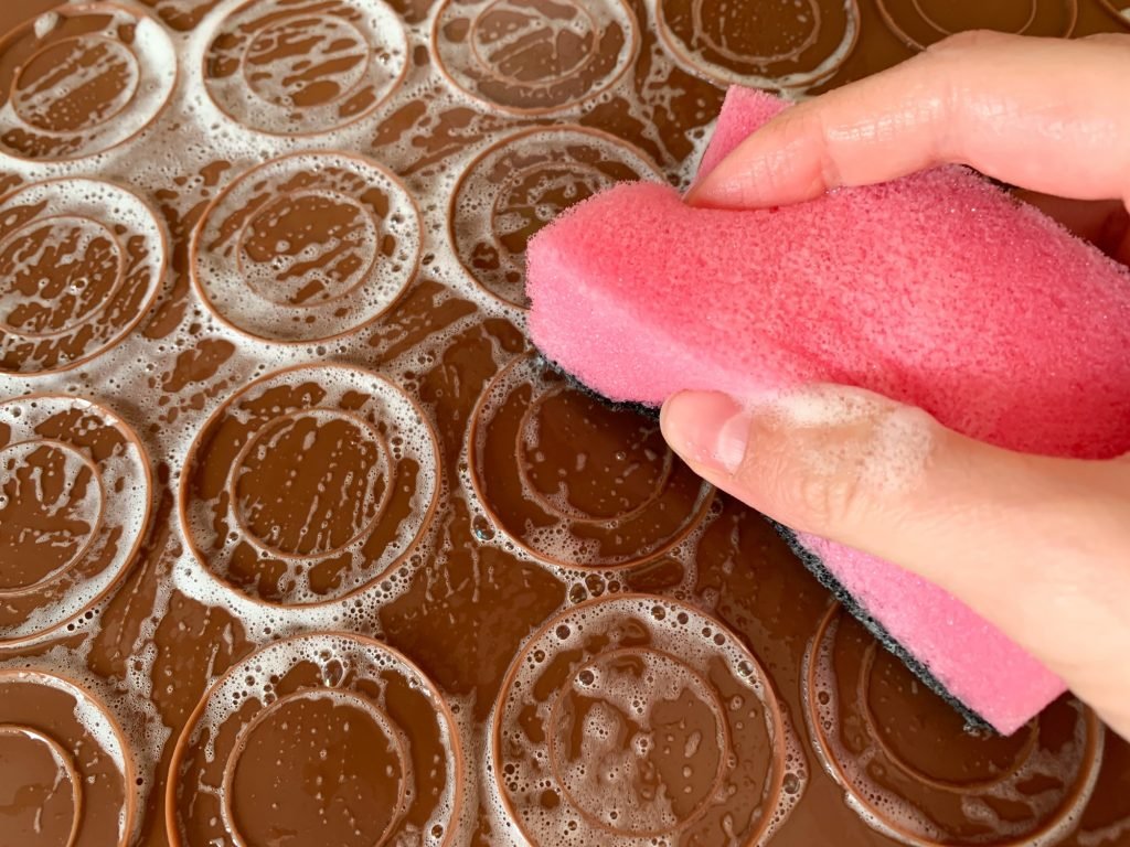 MACARON QUESTION. Please help. I recently bought a silicon macaron mat to  make perfectly shaped macarons, and every time I use it, 75% of the macarons  stick to the mat. (This picture