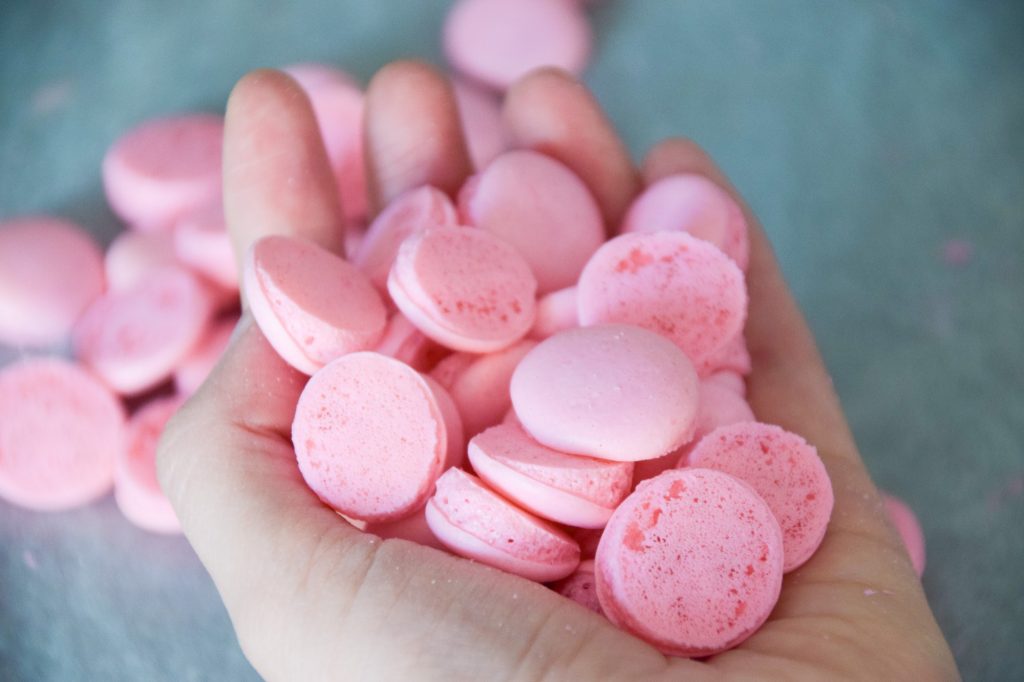 Pink Pastel Lopsided Macarons on hand