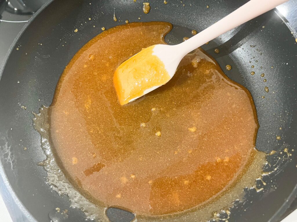 Homemade salted caramel sauce cooking on a pan