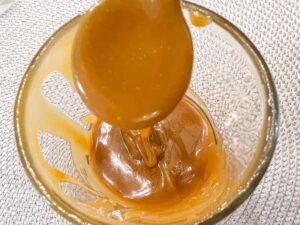 Homemade smooth and runny salted caramel sauce