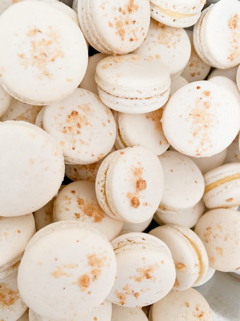 Beige macarons with crushed nuts on it