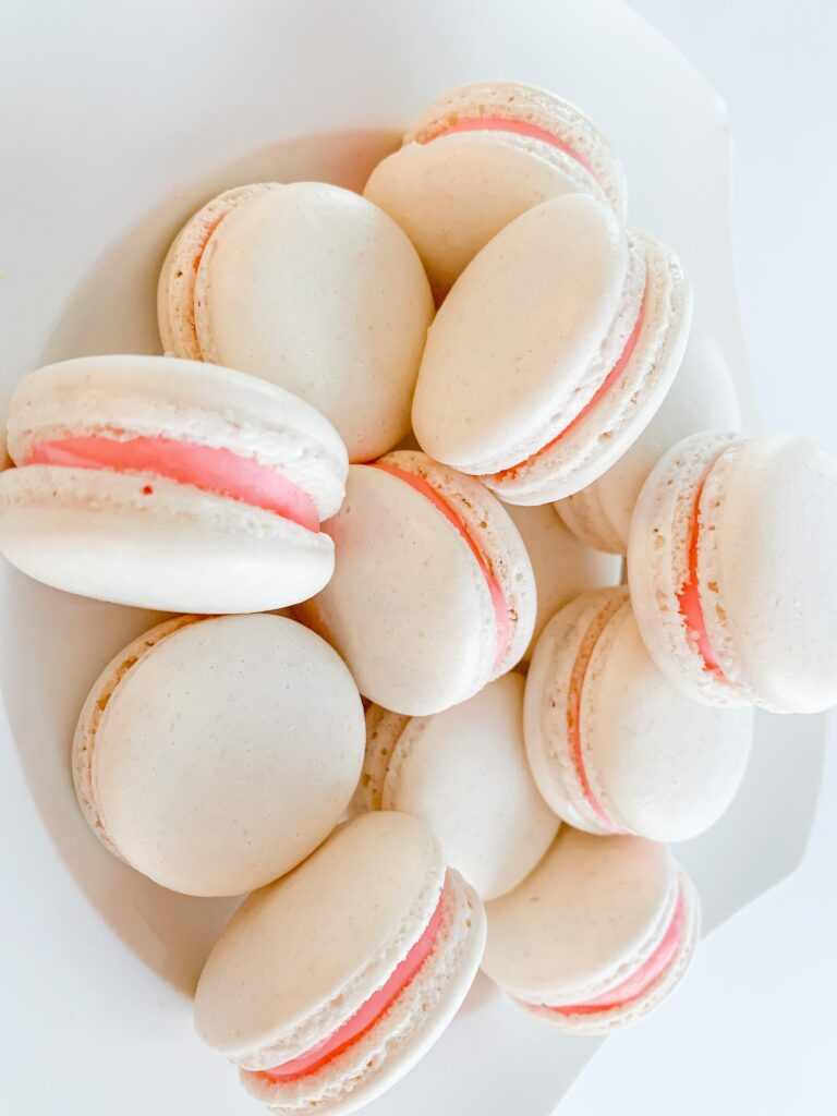 White beige macarons with pink filling