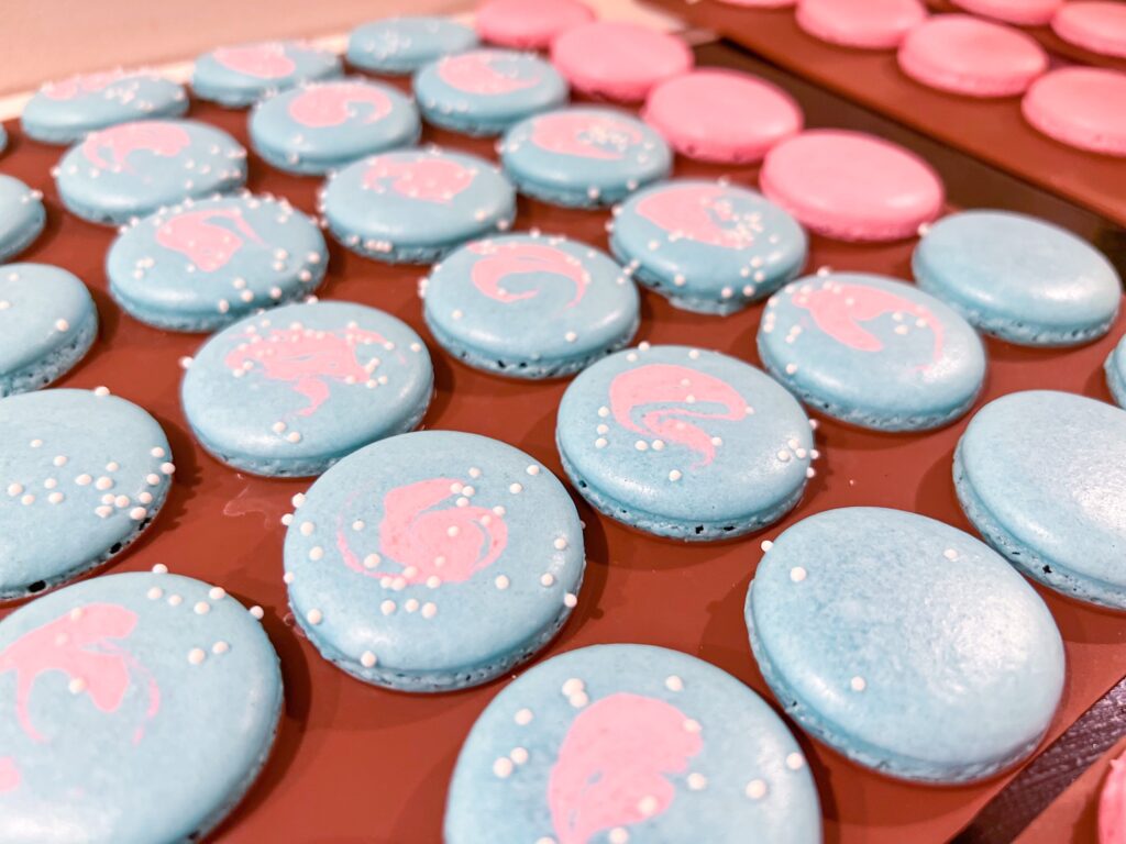 Multicolored bubblegum macarons shells with sprinkles