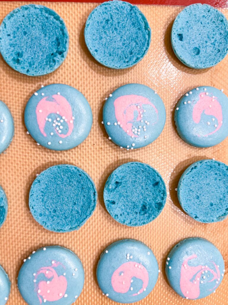 Blue multicolored bubblegum macaron shells with sprinkles
